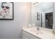 Stylish half-bath featuring vanity, sleek mirror, and a modern framed print at 139 Hardwick Dr, Mooresville, NC 28115