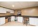 Well-lit craft room with built-in cabinets and counter space, perfect for creative projects at 139 Hardwick Dr, Mooresville, NC 28115