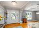 Bright foyer with hardwood floors, chandelier, and views to the outside at 139 Hardwick Dr, Mooresville, NC 28115