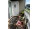 Cozy balcony area features an outdoor rug, vibrant cushions, and relaxing seating at 140 Lake Concord Ne Rd, Concord, NC 28025