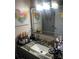 Well-lit bathroom features a gray marbled countertop, a large mirror and ample storage at 140 Lake Concord Ne Rd, Concord, NC 28025