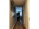 Hallway view looking into the dining area, showcasing hardwood floors and crown molding detail at 140 Lake Concord Ne Rd, Concord, NC 28025