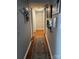 Bright hallway with wood floors, accent rugs and decoratively adorned walls at 140 Lake Concord Ne Rd, Concord, NC 28025