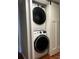 Convenient laundry room with stacked washer and dryer in a small space at 140 Lake Concord Ne Rd, Concord, NC 28025
