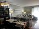 Cozy living room with a beautiful cabinet, dining table, and large couch with soft lighting at 140 Lake Concord Ne Rd, Concord, NC 28025