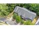 Aerial view of townhomes with dark roofs, mature trees, and paved roads at 14664 Lions Paw St, Charlotte, NC 28273