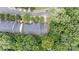 Aerial view of well-maintained townhomes surrounded by mature trees and quiet streets at 14664 Lions Paw St, Charlotte, NC 28273