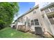 Townhome backyard with wood deck, green grass, and mature trees at 14664 Lions Paw St, Charlotte, NC 28273