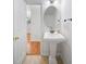 Bathroom featuring a pedestal sink, large mirror, and a view into a bedroom at 14664 Lions Paw St, Charlotte, NC 28273