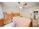 Bedroom featuring a wood bed frame, wood dresser, and a ceiling fan at 14664 Lions Paw St, Charlotte, NC 28273