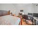 Bedroom with desk setup, monitors, wood laminate flooring, and a comfy bed at 14664 Lions Paw St, Charlotte, NC 28273