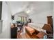 Bedroom with ceiling fan, hardwood flooring, desk, and a window providing natural light at 14664 Lions Paw St, Charlotte, NC 28273
