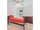 Well-lit bedroom featuring a ceiling fan, window, and stylish wood-framed bed and dresser at 14664 Lions Paw St, Charlotte, NC 28273