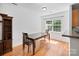 Dining room features hardwood floors, a wooden table with chairs, and natural light at 14664 Lions Paw St, Charlotte, NC 28273