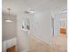 Bright hallway with neutral carpet leading to bedrooms and bathroom at 14664 Lions Paw St, Charlotte, NC 28273