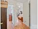 Hallway with wood floors leading into a bedroom at 14664 Lions Paw St, Charlotte, NC 28273