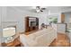 Bright living room featuring hardwood floors, a fireplace, and a comfortable sofa at 14664 Lions Paw St, Charlotte, NC 28273