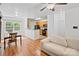 Open concept living and dining area with a view of the kitchen and wood flooring at 14664 Lions Paw St, Charlotte, NC 28273