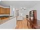Open-concept living space with modern kitchen and dining area with fireplace at 14664 Lions Paw St, Charlotte, NC 28273