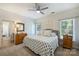 Comfortable bedroom with a ceiling fan, carpet floors, and two windows bringing in natural light at 159 Carsons Pl, Mooresville, NC 28117