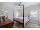 Cozy bedroom featuring a four-poster bed and bright windows at 159 Carsons Pl, Mooresville, NC 28117