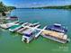 Boat dock featuring multiple slips on a serene lake at 159 Carsons Pl, Mooresville, NC 28117