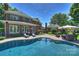 Gorgeous in-ground pool with brick surround and an outdoor seating area at 159 Carsons Pl, Mooresville, NC 28117