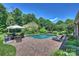 In-ground pool surrounded by a brick patio and comfortable lounge chairs at 159 Carsons Pl, Mooresville, NC 28117