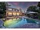 Stunning pool with outdoor seating, lush landscaping, and views of the beautiful backyard, ideal for relaxation at 159 Carsons Pl, Mooresville, NC 28117