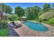 In-ground pool surrounded by a brick patio and comfortable lounge chairs at 159 Carsons Pl, Mooresville, NC 28117