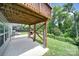 Backyard with outdoor seating, well-maintained lawn, wooden deck above, offering a relaxing outdoor space at 1604 Trentwood Dr, Fort Mill, SC 29715