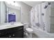 Clean bathroom features a floral shower curtain, toilet, and single sink vanity at 1604 Trentwood Dr, Fort Mill, SC 29715