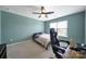 Bedroom with a ceiling fan, carpet, and a desk set by the window at 1604 Trentwood Dr, Fort Mill, SC 29715