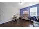 Bright bedroom with a crib, hardwood floors, neutral walls, and ample natural light at 1604 Trentwood Dr, Fort Mill, SC 29715