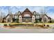 The community clubhouse features an attractive entry, manicured landscaping, and large windows at 1604 Trentwood Dr, Fort Mill, SC 29715