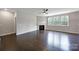 Inviting living room features dark hardwood floors, a cozy fireplace, and large windows at 1604 Trentwood Dr, Fort Mill, SC 29715