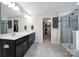 Modern main bathroom with a double vanity, glass shower, and walk-in closet at 1604 Trentwood Dr, Fort Mill, SC 29715