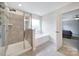 Bathroom featuring a glass enclosed shower, soaking tub, and window at 1604 Trentwood Dr, Fort Mill, SC 29715