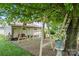 Lovely backyard with a swing set, mature tree, shed, and lush landscaping offers a peaceful outdoor retreat at 1627 33Rd Ne Ave, Hickory, NC 28601