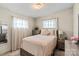 Inviting bedroom with warm tones, decorative pillows, and a serene atmosphere at 1627 33Rd Ne Ave, Hickory, NC 28601