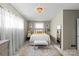 Bright bedroom with a ceiling light, plush bedding, and neutral color palette at 1627 33Rd Ne Ave, Hickory, NC 28601