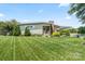 Charming single-story home featuring a well-manicured lawn, covered entry, and mature landscaping at 1627 33Rd Ne Ave, Hickory, NC 28601