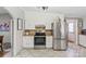 Well-lit kitchen features stainless steel appliances, white cabinets, and tile flooring at 1627 33Rd Ne Ave, Hickory, NC 28601