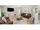 Cozy living room with a brick fireplace, comfortable seating, and tiled flooring at 1627 33Rd Ne Ave, Hickory, NC 28601