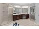 Elegant bathroom with a glass-enclosed shower, soaking tub, and dual sink vanity at 165 Futrell Lndg, New London, NC 28127
