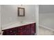 Powder room with cherry wood cabinets and white countertop at 165 Futrell Lndg, New London, NC 28127