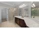 Bathroom featuring a glass door shower, a soaking tub, and dual vanities with lighting at 165 Futrell Lndg, New London, NC 28127