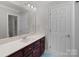 Bathroom featuring white countertop with cherry wood cabinets at 165 Futrell Lndg, New London, NC 28127