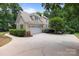 House exterior with driveway and attached garage at 165 Futrell Lndg, New London, NC 28127