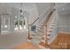 Inviting foyer featuring a staircase with wooden railings and plenty of natural light at 165 Futrell Lndg, New London, NC 28127